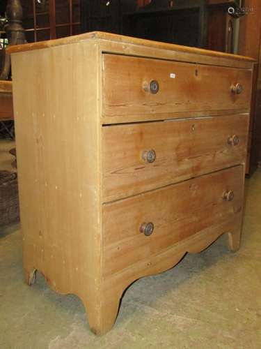 A 19th century stripped pine bedroom chest of three long gra...