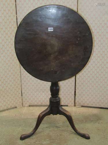 A small Georgian mahogany tripod table with turned vase shap...