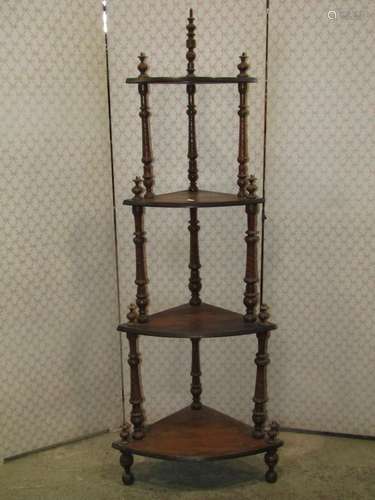 A Victorian walnut veneered floorstanding corner whatnot on ...