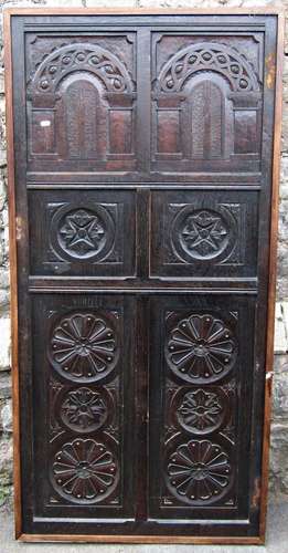 An antique oak door in the old English style enclosing six c...