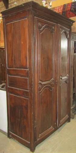 An 18th century oak or possibly chestnut armoire enclosed by...