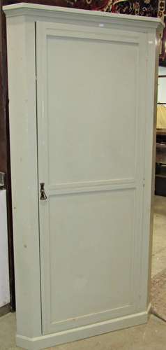 An Edwardian floorstanding corner cupboard with light green ...