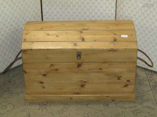 A stripped pine domed top chest of tongue and groove boarded...