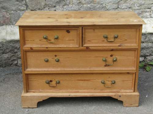 A low stripped pine bedroom chest in the Georgian style of t...