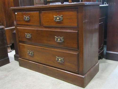 An Edwardian walnut bedroom chest of two long and two short ...