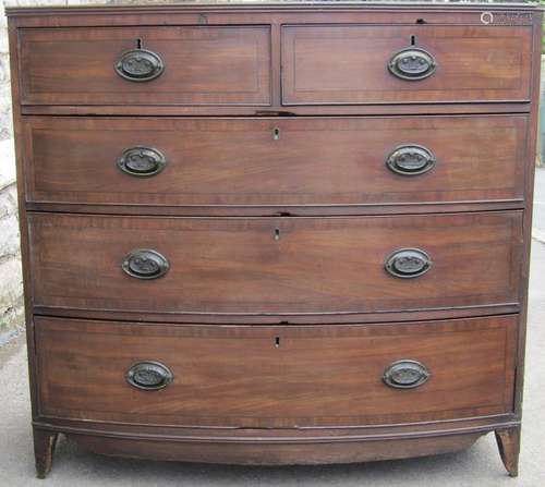 A Regency mahogany bow fronted bedroom chest of two short ov...