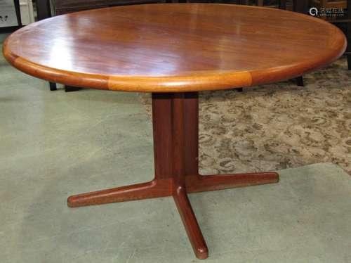 A teak D end extending dining table with two additional leav...