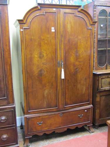 A Queen Ann style walnut veneered wardrobe or hanging cupboa...