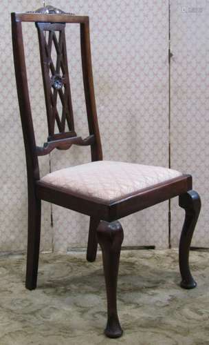 A set of four Edwardian high back dining chairs with carved ...