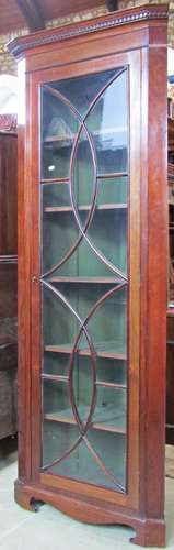 A mahogany freestanding corner cabinet in the Georgian style...