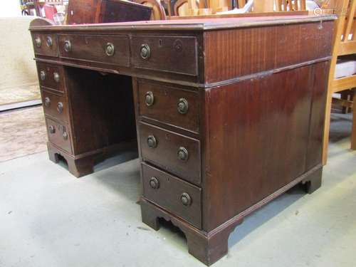 Georgian style pedestal desk fitted with nine drawers and in...