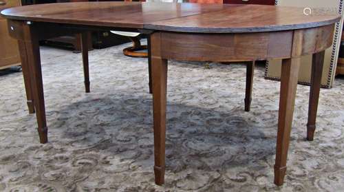 A Georgian mahogany D end sectional dining table with reeded...