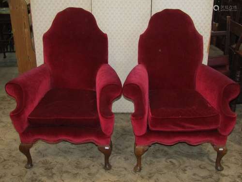 A pair of Queen Ann style armchairs with shaped outline, swe...