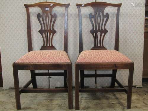 A pair of Georgian fruit wood country made dining chairs wit...