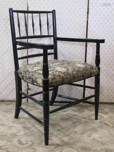 A Sussex style open elbow chair in the arts and crafts manne...