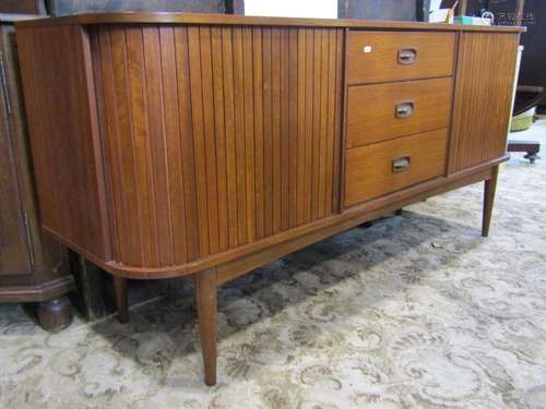 An Austinsuite teak sideboard, fitted with a tower of three ...