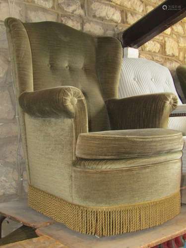 A pair of sage green coloured upholstered armchairs with but...