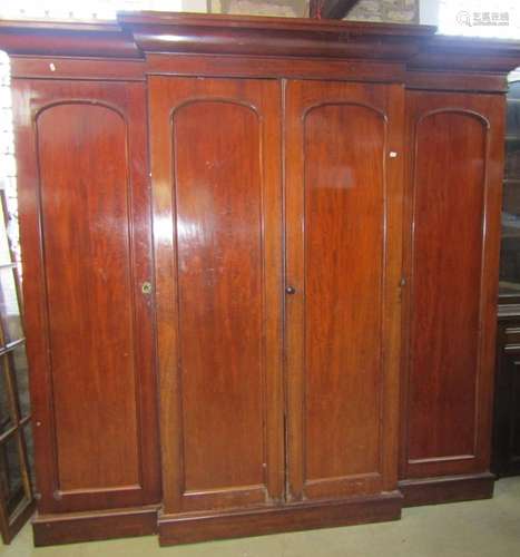 A Victorian mahogany breakfront wardrobe with fitted interio...