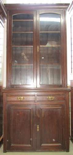 An Edwardian library bookcase, the based enclosed by two pan...