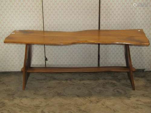 A rustic elm occasional table of rectangular form with board...