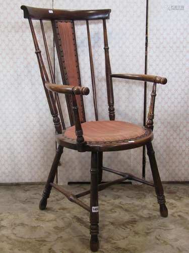 An Edwardian open elbow chair with circular upholstered pad ...