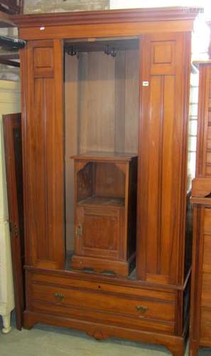 A suite of Edwardian American walnut bedroom furniture compr...