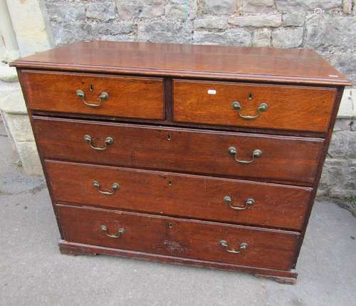 A Georgian oak country made bedroom chest of two short over ...