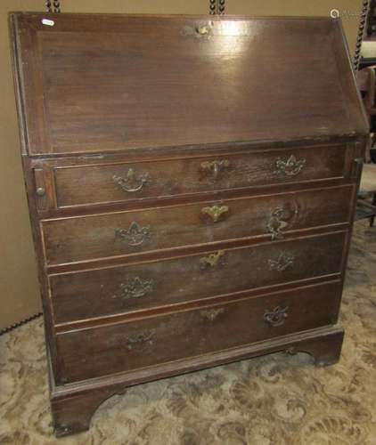 A Georgian style oak bureau for four long graduated drawers,...