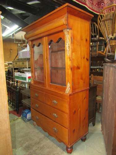 A 19th century stripped and waxed pine two tier cabinet, the...