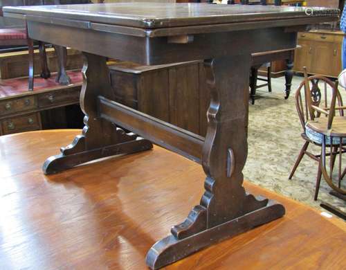 An Ercol dining room suite comprising a sideboard, the centr...