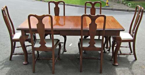 An Edwardian mahogany dining room suite comprising an extend...