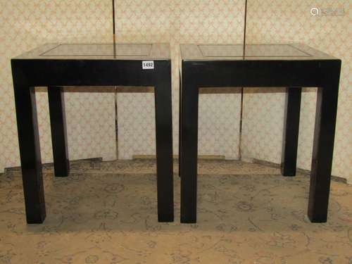 A pair of Chinese ebonised occasional tables of square cut f...