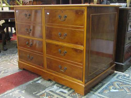 A yewwood veneered filing cabinet of four drawers presented ...