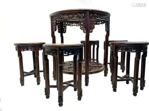 A SET OF CHINESE QING DYNASTY MAHOGANY TABLES AND CHAIRS