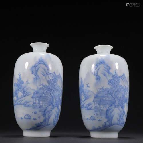 A pair of blue and white landscape character bottles