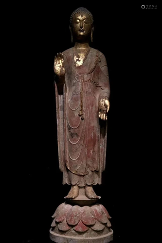 A Carved Stone Standing Buddha Statue