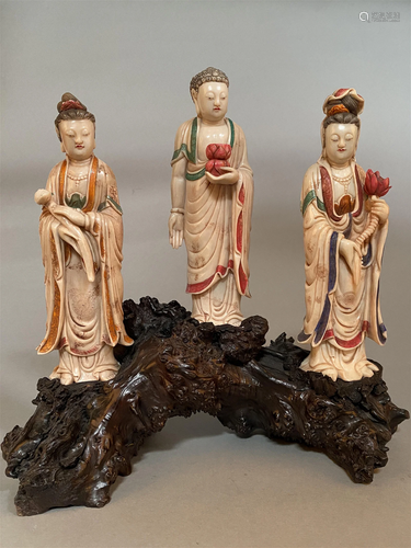 A Group of Three Soapstone Statues