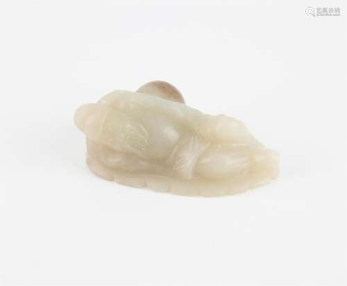 A Chinese jade figure of Lu Dongbin. Carved sleeping against...