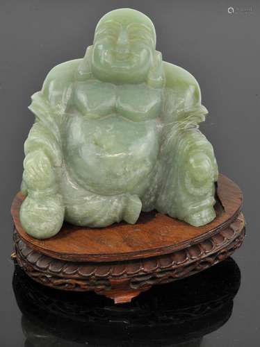 Large jade Buddha, holding a gourd in one hand and a rosary ...