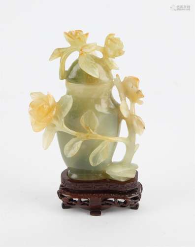 Chinese jade lidded jar decorated with carved flowers and vi...