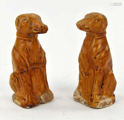 A Chinese Pair of Amber–Glazed pottery figures of Dogs. Tang...