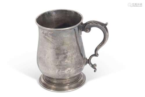 Late George II one pint baluster tankard with leaf capped do...