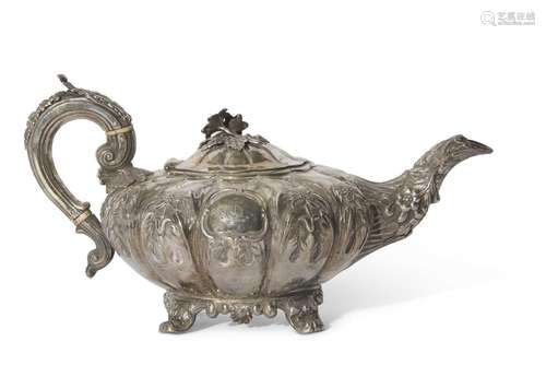 Large Victorian Irish silver teapot of melon form heavily em...