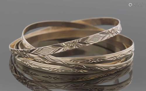 Three hallmarked 9ct gold bangles and one stamped 9kt, 26.3g...