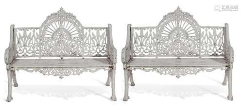 A pair of Coalbrookdale style cast iron garden seats in the ...