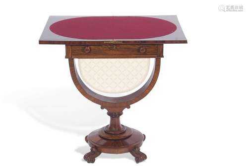 A Victorian rosewood sewing table with fold-over baize lined...