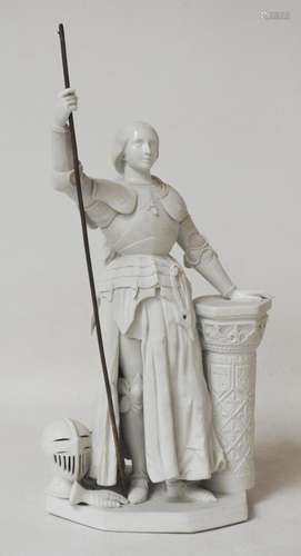 Sujet en biscuit figurant Saint Jeanne d'Arc en pied, main p...