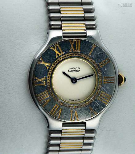 CARTIER<br />
Montre bracelet de dame “Must 21”en acier et p...