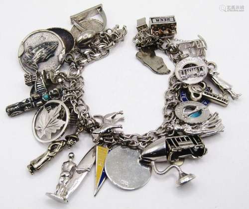 VINTAGE STERLING CHARM BRACELET LOADED WITH