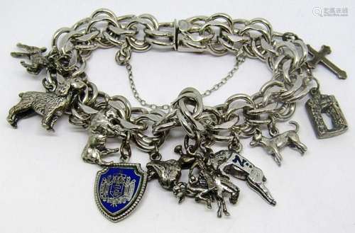 VINTAGE STERLING CHARM BRACELET LOADED WITH